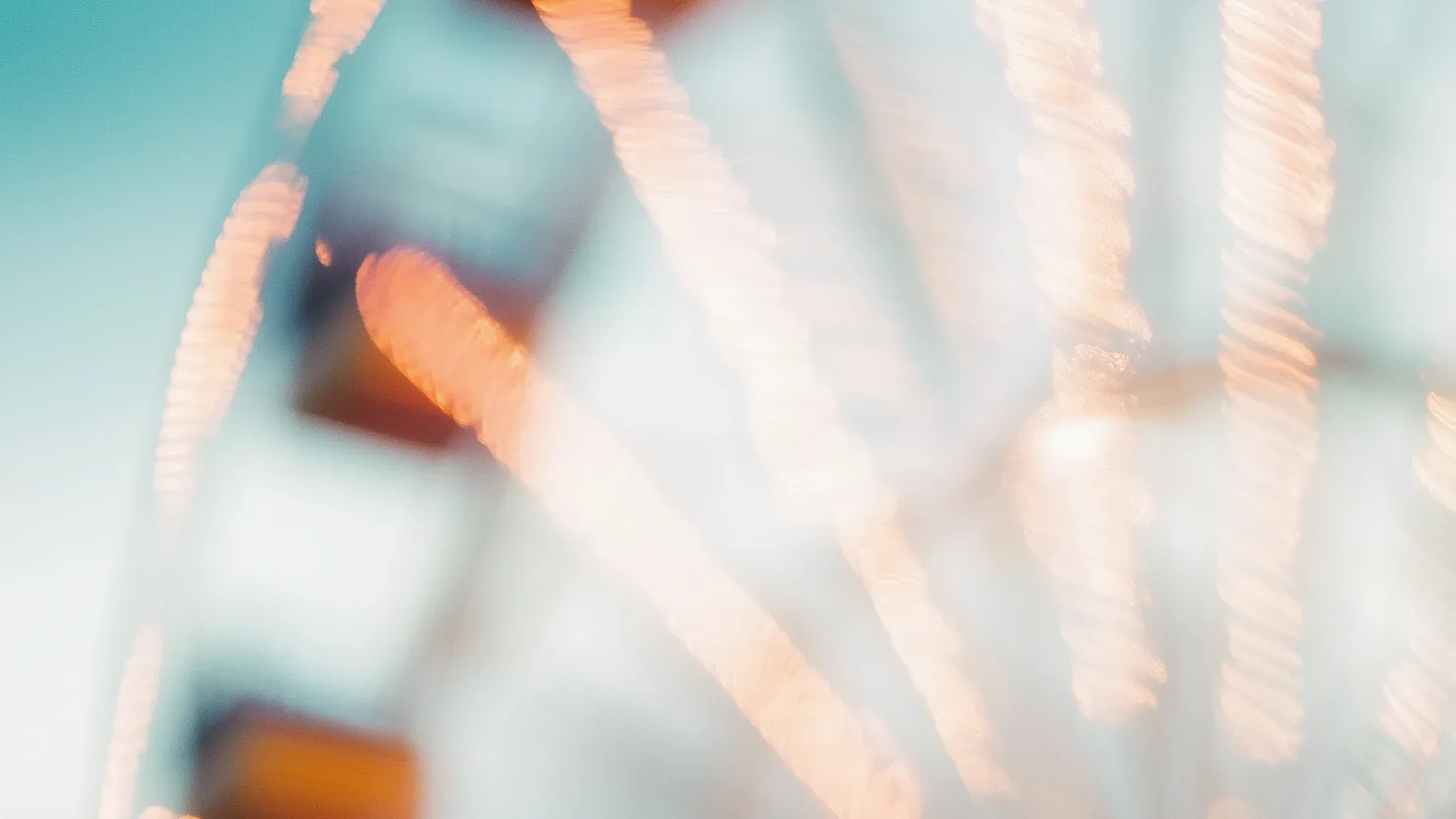 Ferris wheel lights blur in motion, suggesting how a novel's tonal priorities must remain recognizable when later scenes increase the pressure.
