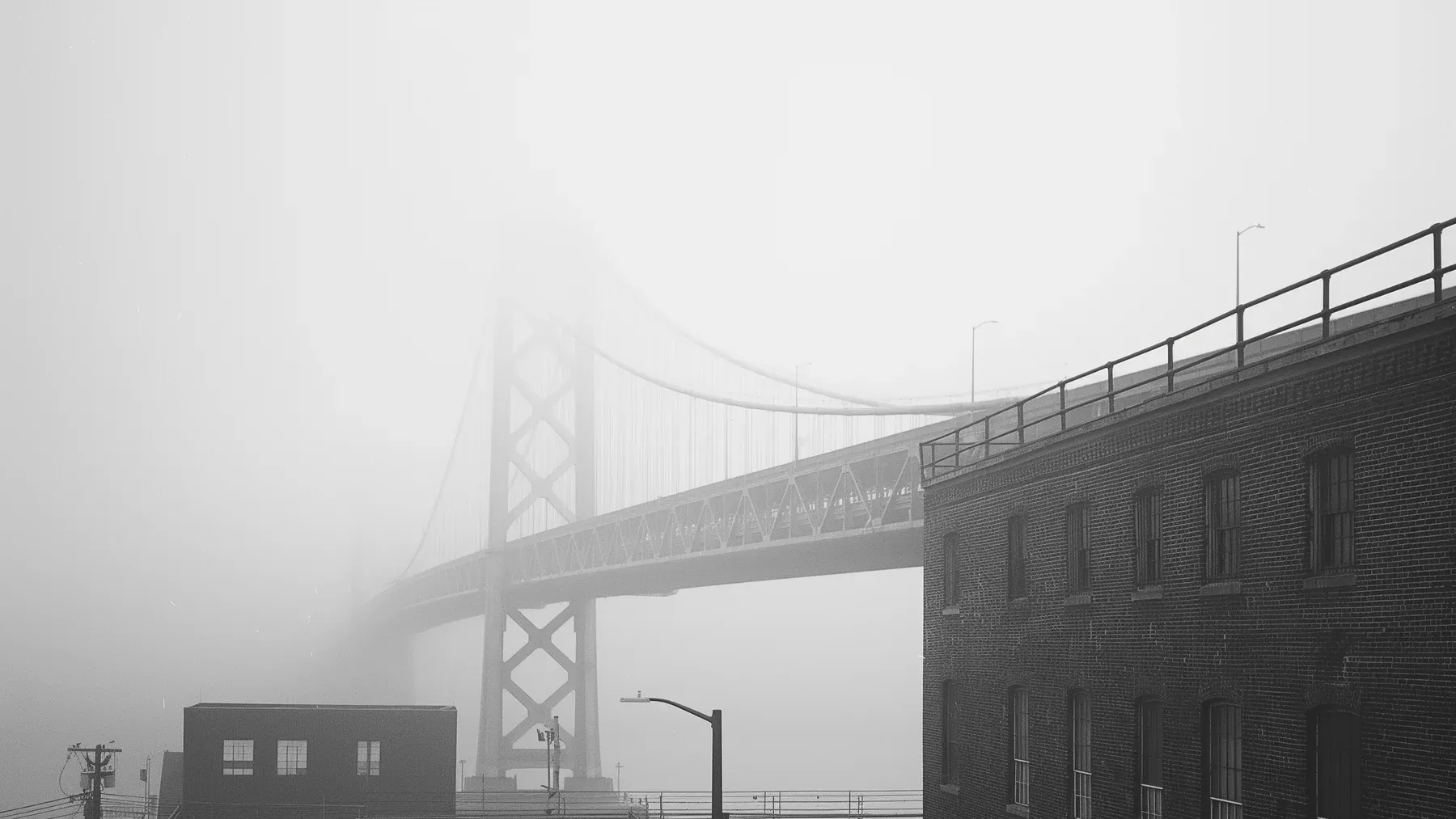 A bridge disappearing into fog demonstrates how a route boundary can remove information while narrowing the available path.