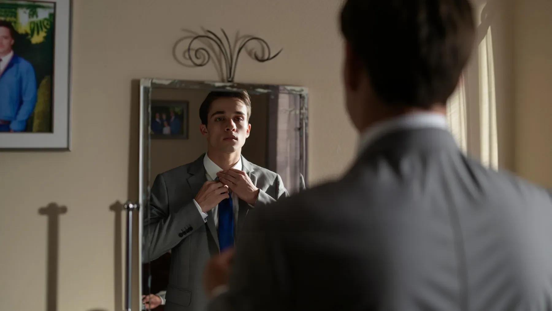 A professional adjusts a tie before work, showing preparation as repeated labor rather than proof of the person's origin or worth.