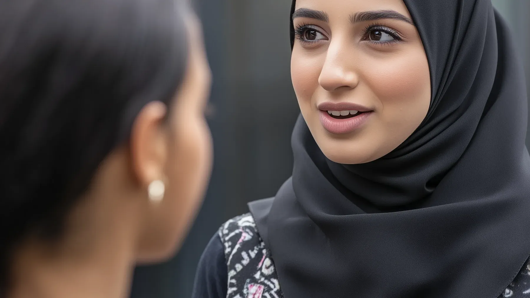 Two women in close conversation, showing that a confession becomes dramatic when one person gives another the power to respond.