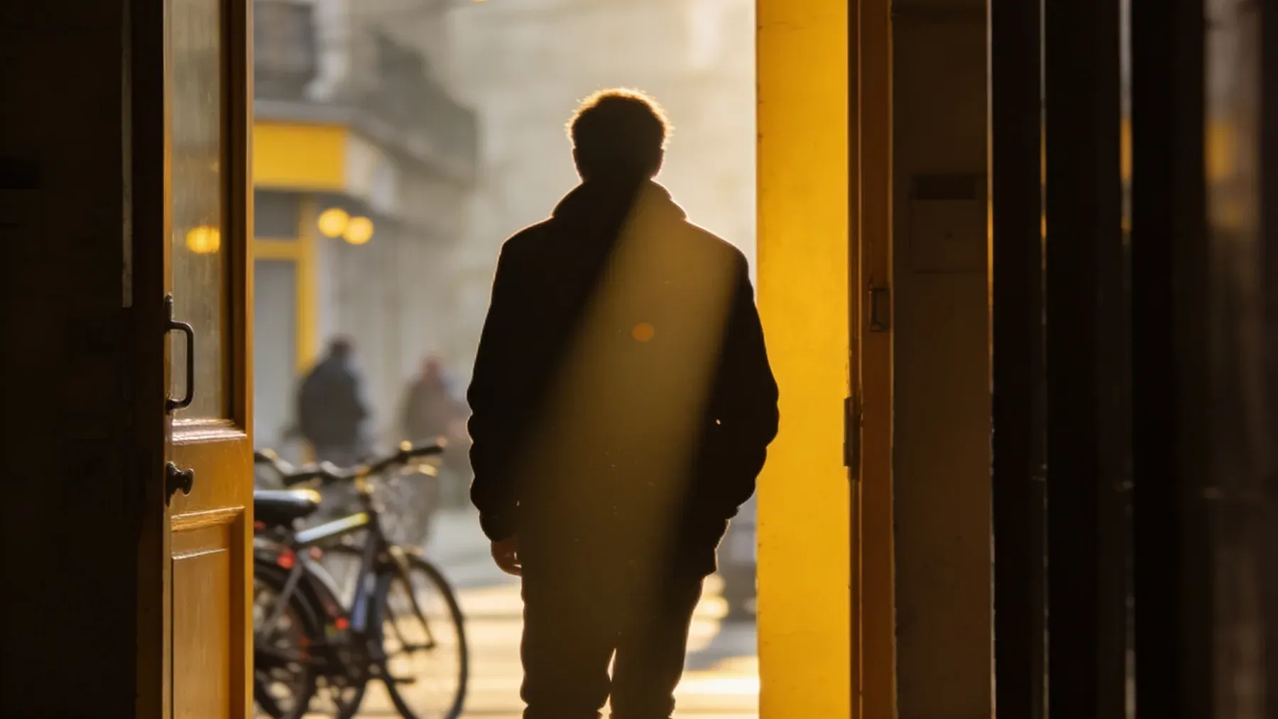 A character leaving the protected command room to act on a new decision, carrying the low point directly into the final confrontation.