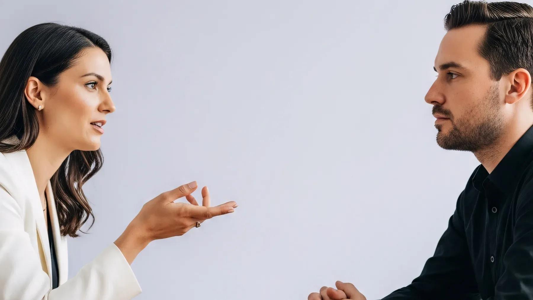 Two people in a tense exchange where posture, distance, and attention change the meaning of the spoken lines.