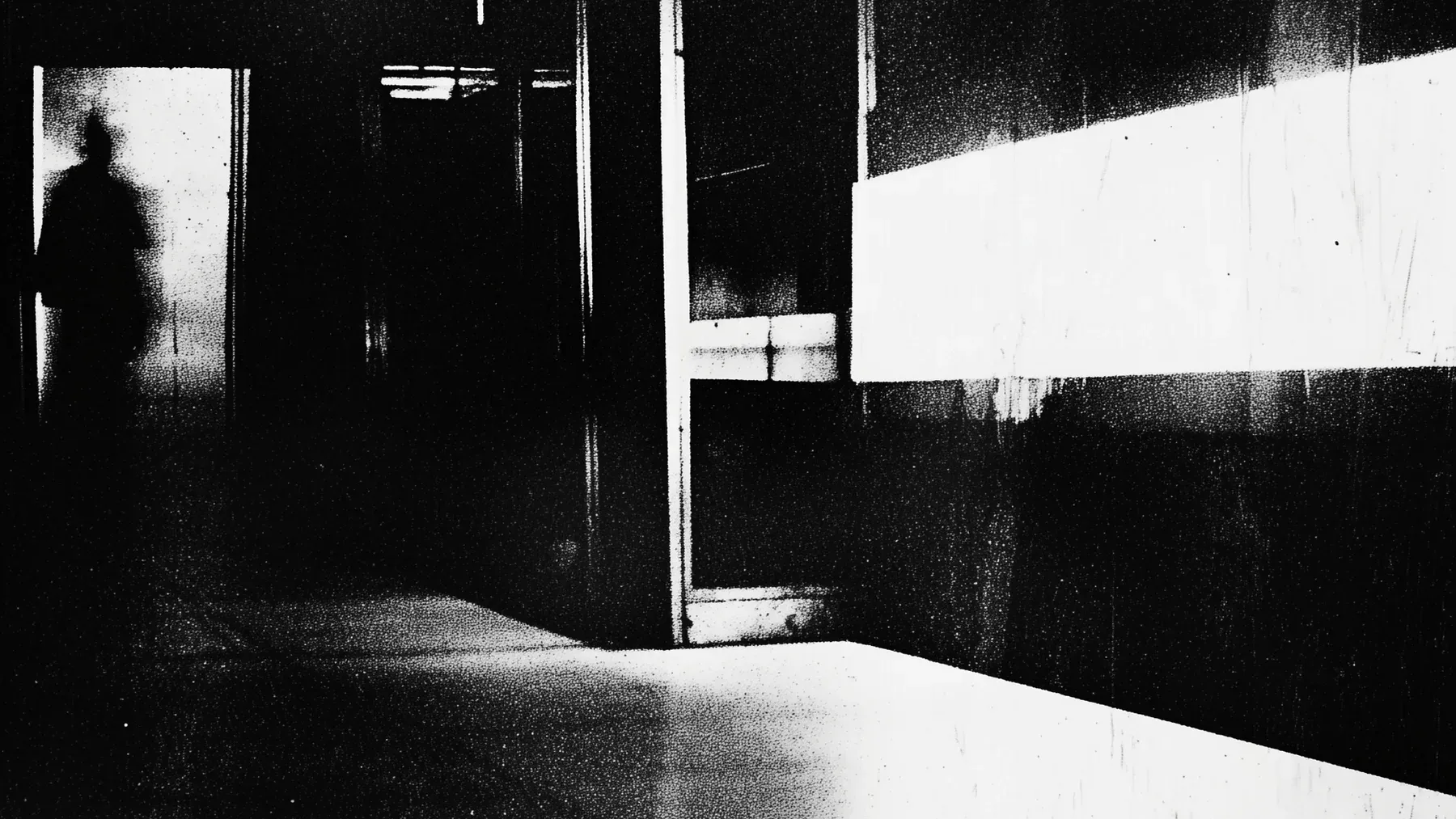 A shadow waits beyond a brightly divided corridor, establishing an escape problem made from visibility, access, and controlled space.
