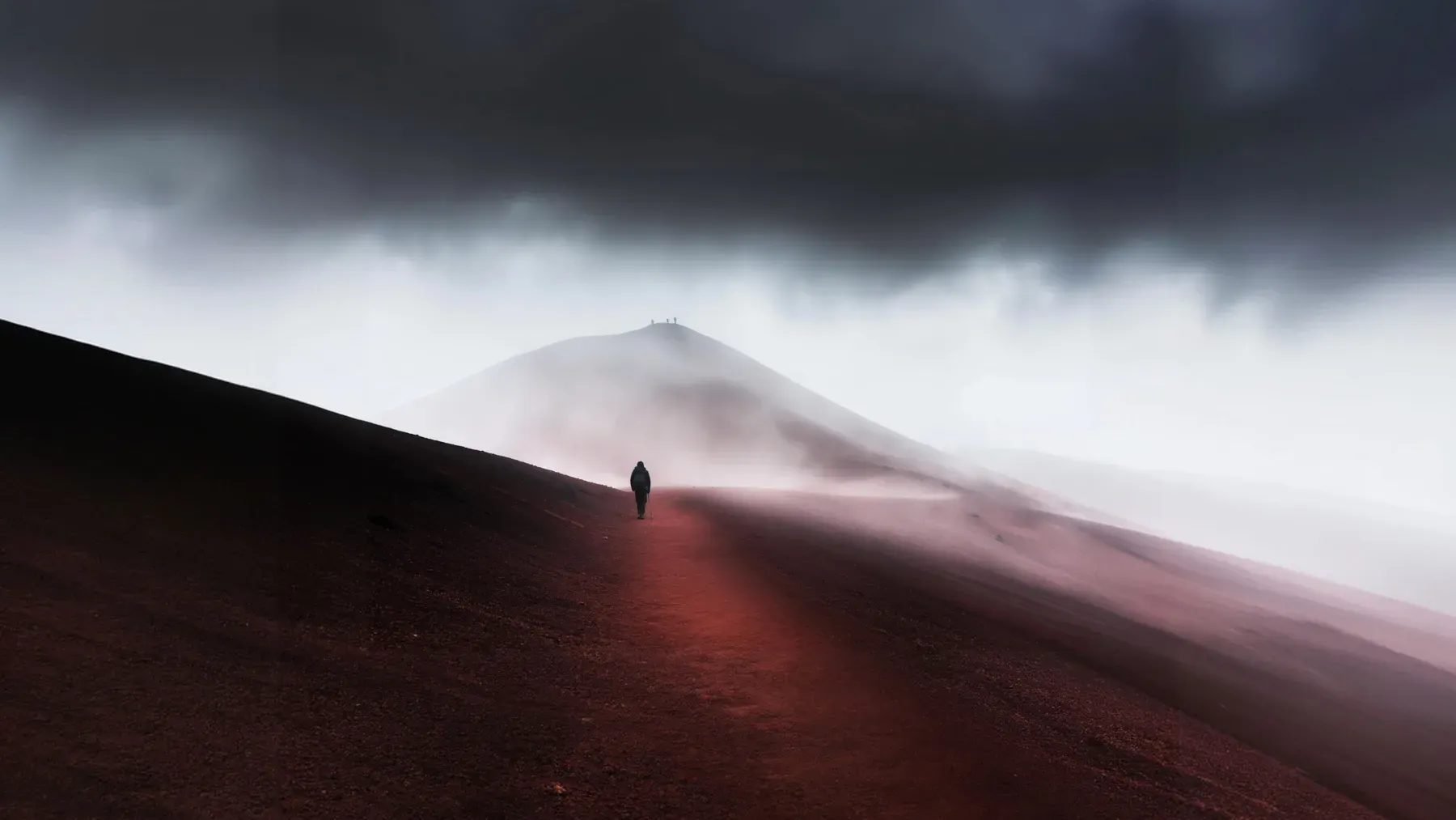 A solitary traveler follows a narrow route through misty terrain, where the old jurisdiction has ended and the next one remains uncertain.