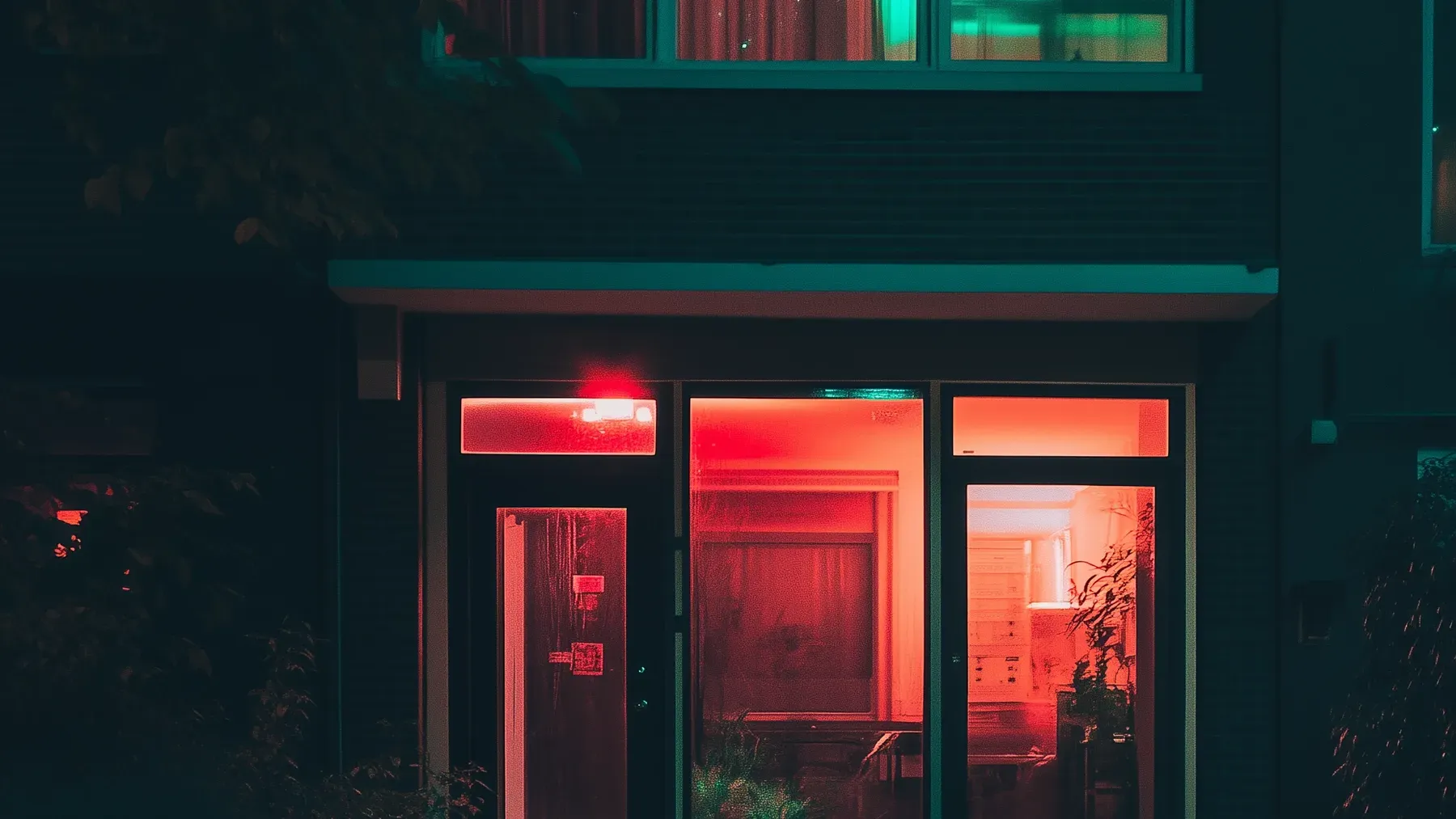 A residence glowing at night, where the building's physical systems can preserve evidence or conceal it.