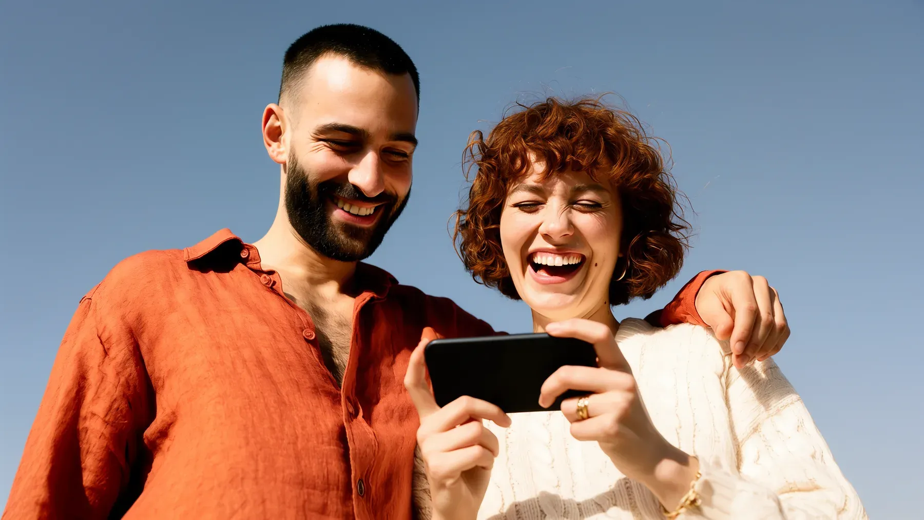 A laughing couple illustrates the ease and mutual attention that a romantic comedy must gradually make consequential.