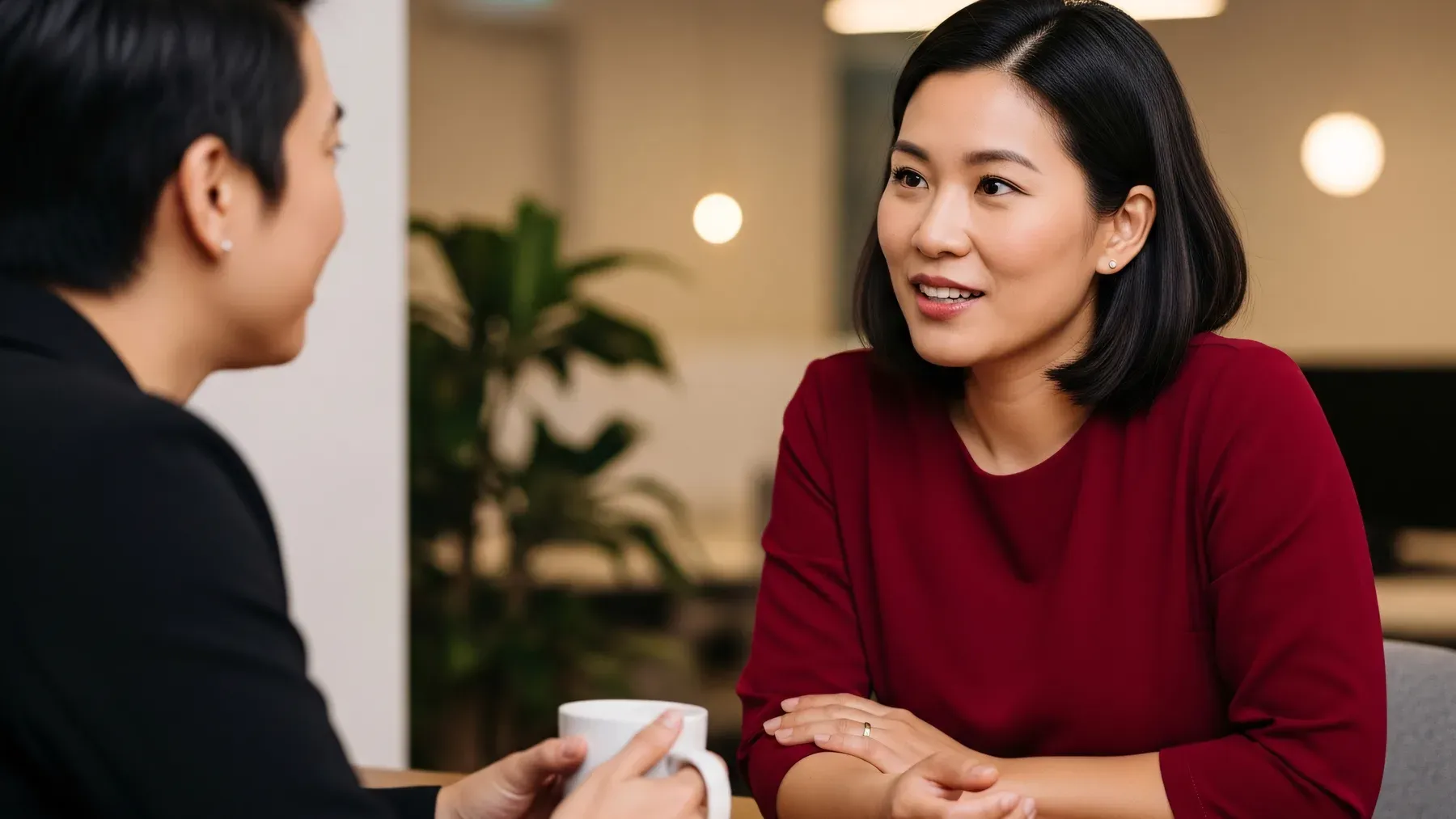 Two people speak across a table, emphasizing that romantic tension changes meaning through the listener's response.