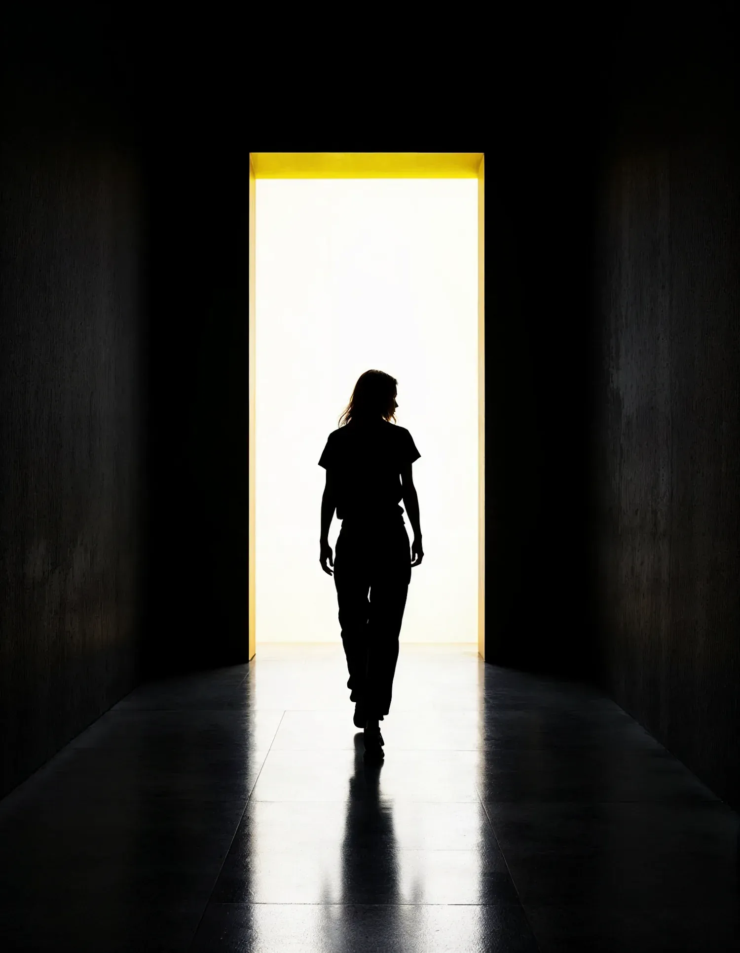 A solitary figure crossing a bright threshold, capturing the moment a consequential choice carries a character beyond the scene's original possibilities.