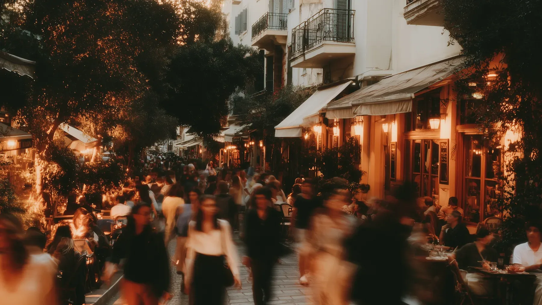 A busy neighborhood at dusk shows how public life, work, memory, and local custom give one district its own magical conditions.
